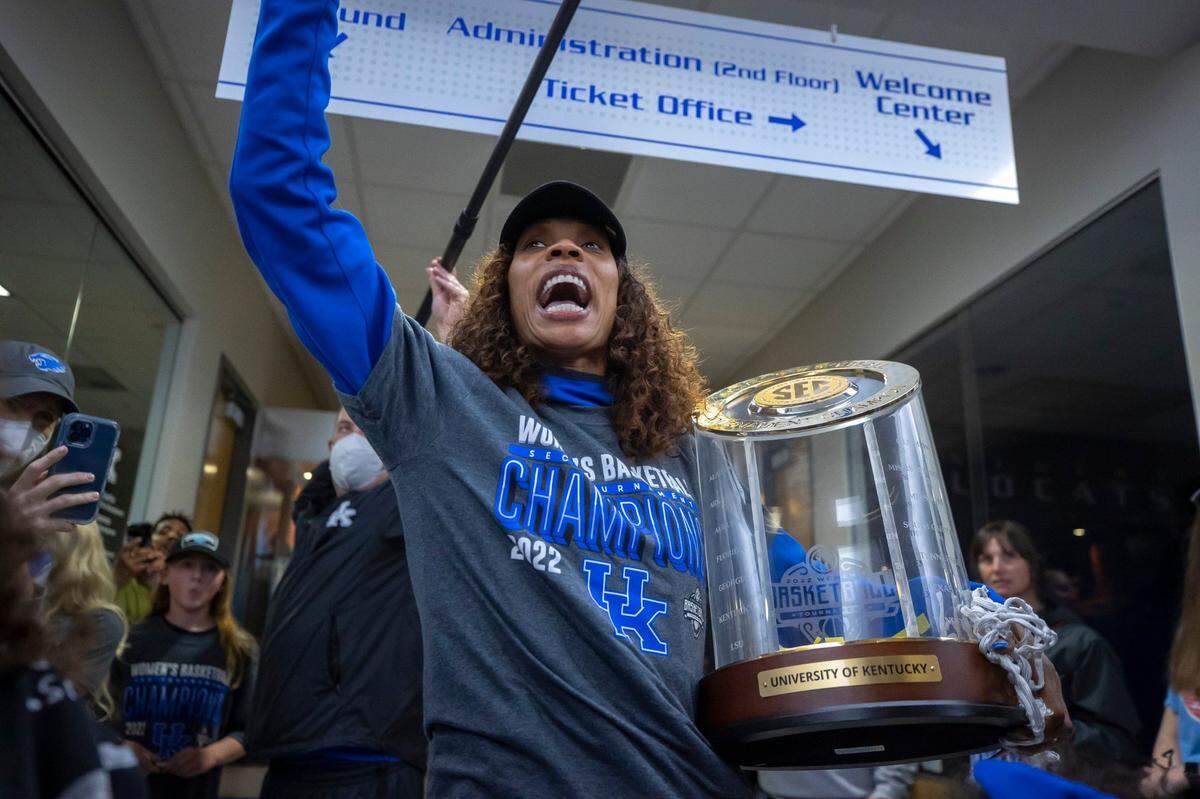 Kyra Elzy carries the championship trophy upon the team’s return to campus after winning the Southeastern Conference Tournament for the first time in 40 years last month. On Monday, Elzy received a contract extension as head coach through the 2027 season.