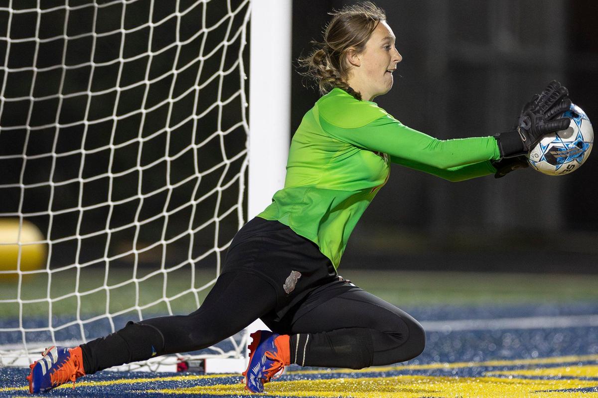 Madison Central’s Abigail Moore (1) stops a ball during Thursday night’s penalty kick shootout.