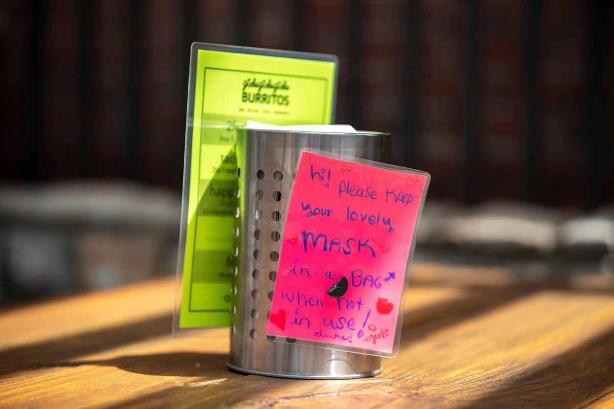 Small bags are provided to store diners’ masks at GirlsGirlsGirls Burritos.