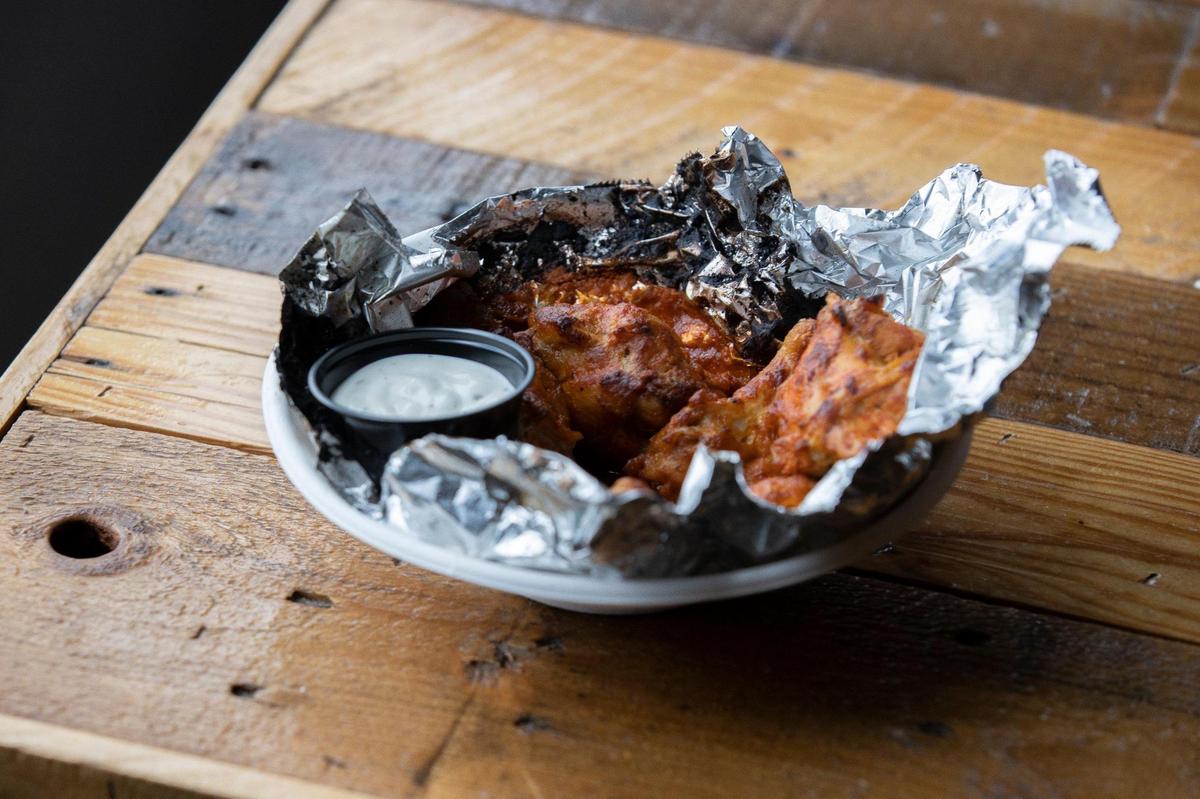 Buffalo wings from Rolling Oven inside the kitchen at Mirror Twin Brewing Co.