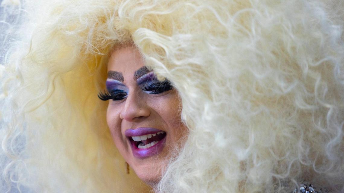 Drag performer May O’Nays sings before a LGBTQ rally in the rotunda at the Kentucky state Capitol in Frankfort, Ky., on Wednesday, Feb. 21, 2024.