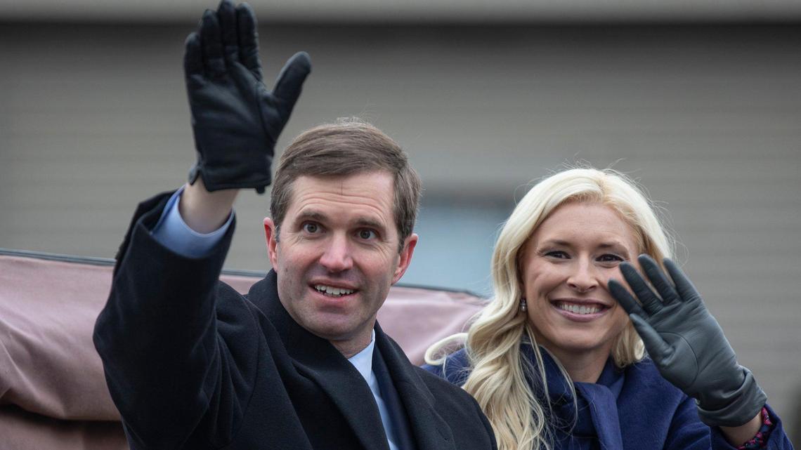Kentucky Gov. Andy Beshear and his wife, Britainy, wave to supporters during the inaugural parade in Frankfort, Ky., Tuesday, Dec. 10, 2019.