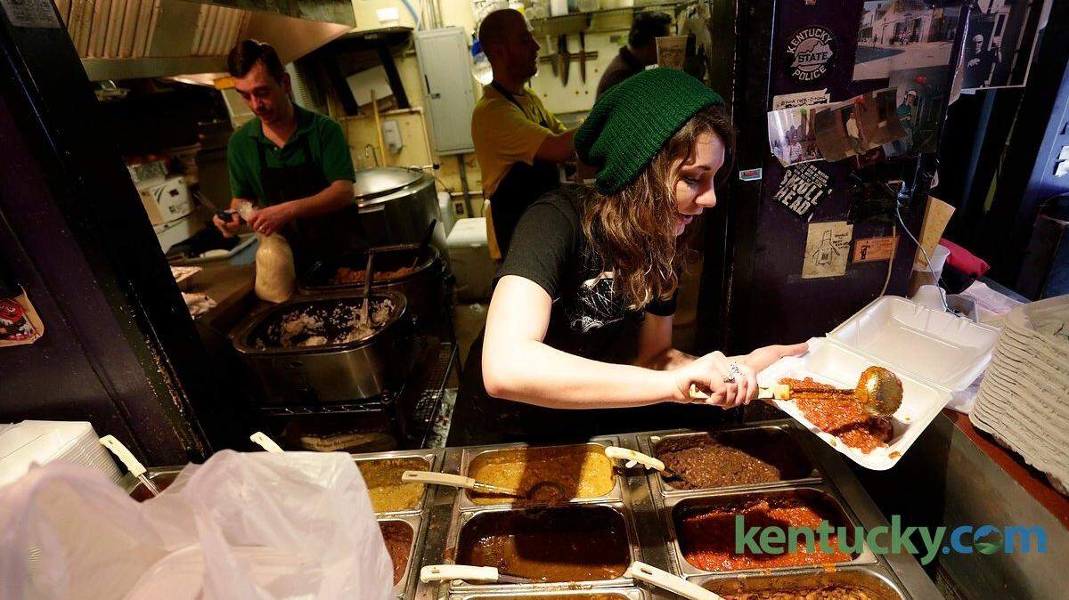 Mimi Bates served up food to hungry customers at Bourbon 'nToulouse in  Lexington, Ky., on Feb. 17, 2015.The cajun restaurant was serving up snowed in customers celebrating Fat Tuesday. Photo by Pablo Alcala | Staff