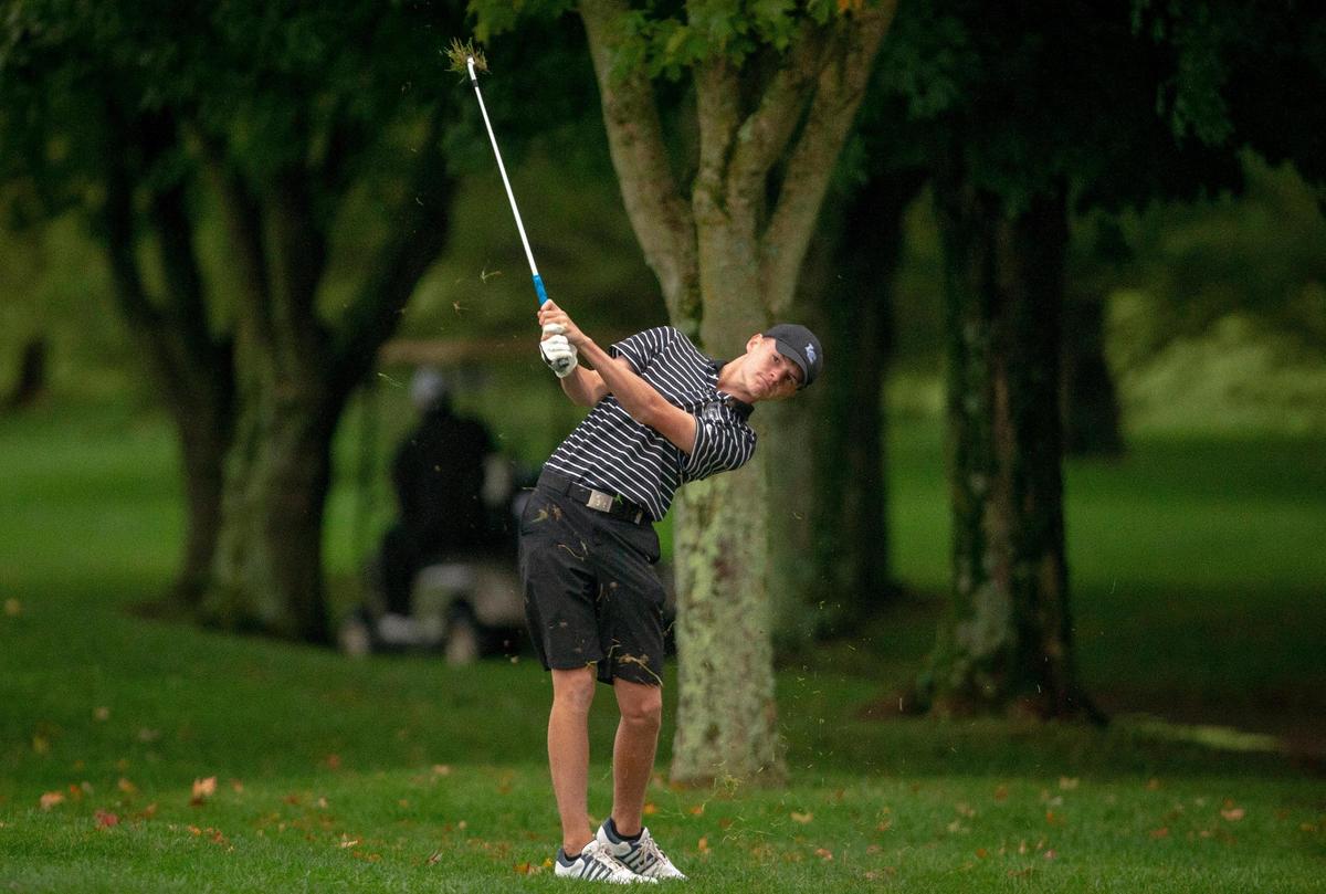 Charlie Spiller of Lexington Catholic hit from the rough on No. 18 during the Region 9 Championship on the University Club of Kentucky’s Big Blue Course on Monday. Spiller finished as the runner-up after two playoff holes.