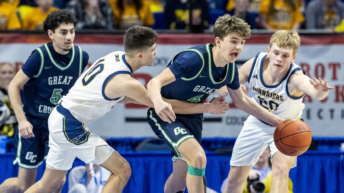 Great Crossing's Graham Swartz (4) breaks the defense of Danville Christian's Eli Perez (10), left, and Danville Christian's Graham Domidion (20), right, during the Warhawks 57-47 first-round win over the Warriors in the 2026 UK Healthcare Boys' Basketball Sweet 16 state tournament, Wednesday, March 18, 2026 at Rupp Arena in Lexington, Ky.