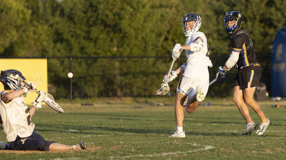 Sayre goalie Fionn McKay, left, deflected a shot from Henry Clay’s Joseph Martinez, right, as Spartans’ midfielder Paul Miller looked back for the ball during Sayre’s 13-5 victory at Sayre Athletic Complex on Friday.