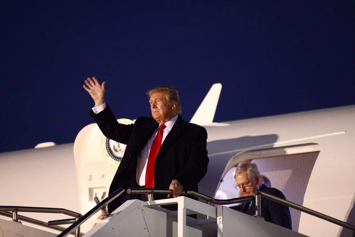 President Donald Trump, with U.S. Senate Majority Leader Mitch McConnell, arrives at Blue Grass Airport on Monday, November 5. Trump flew to Lexington for a rally the night before the Kentucky general election.