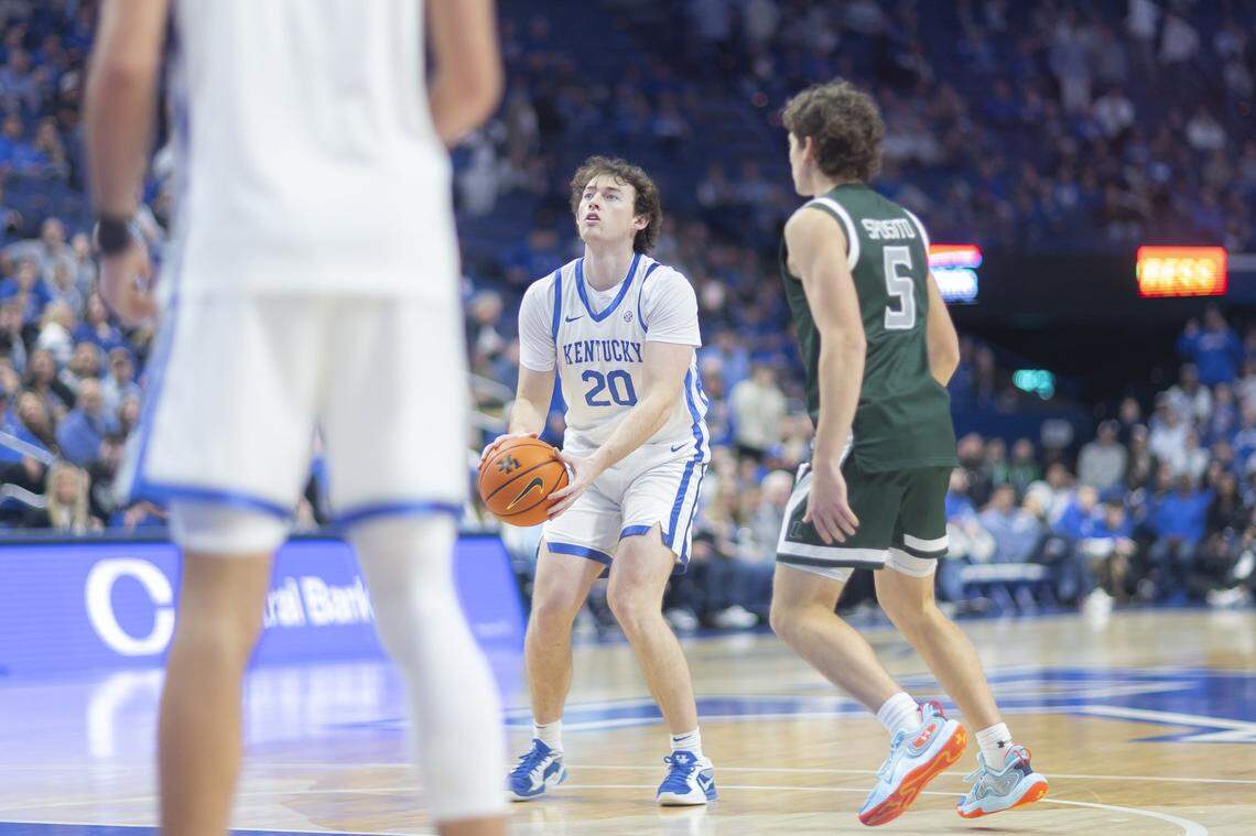 Kentucky basketball forward Zach Tow (20) looks to shoot the ball past Loyola (Maryland) guard Peter Sposito (5) during a game at Rupp Arena on Nov. 21.