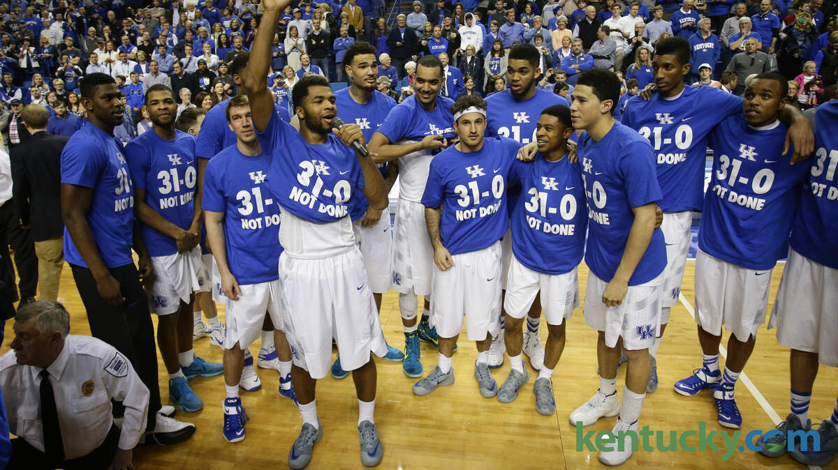 Kentucky players showed off new shirts marking the team's undefeated regular season. "Not done" refers to the SEC tournament this weekend and then the NCAA tournament. 
