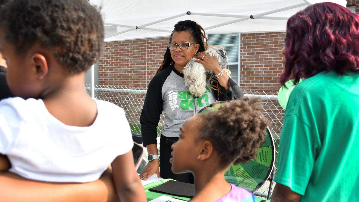 Dawn Runyon informs community members about Green Dot during Winburn Public Safety Day on Wednesday, June 28, 2023 at the Community Action Council Center in Lexington, Ky. 
