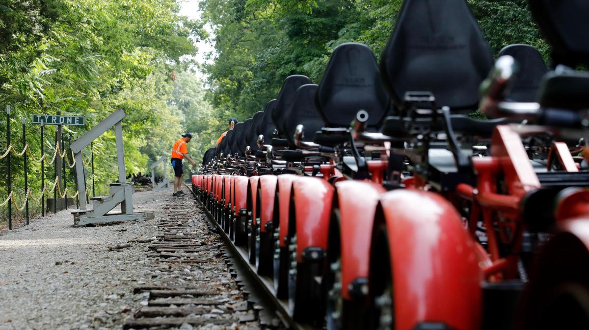 Employees work on turning the “Rail Explorer” vehicles for the return trip on Friday, Aug. 4, 2023 at the Bluegrass Scenic Railroad and Museum in Versailles, Ky.