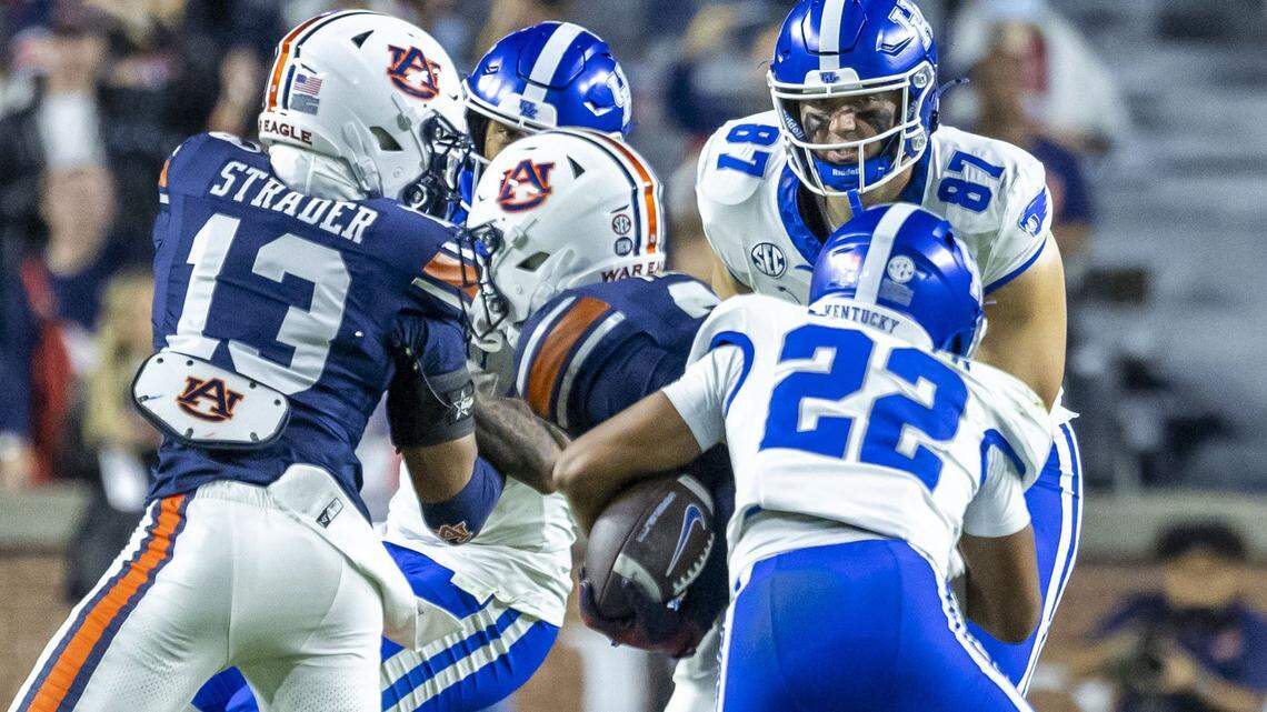 Kentucky wide receiver Cameron Miller (22) forces Auburn safety AnQuon Fegans to fumble the ball after Fegans had intercepted a Cutter Boley pass during UK’s 10-3 win.