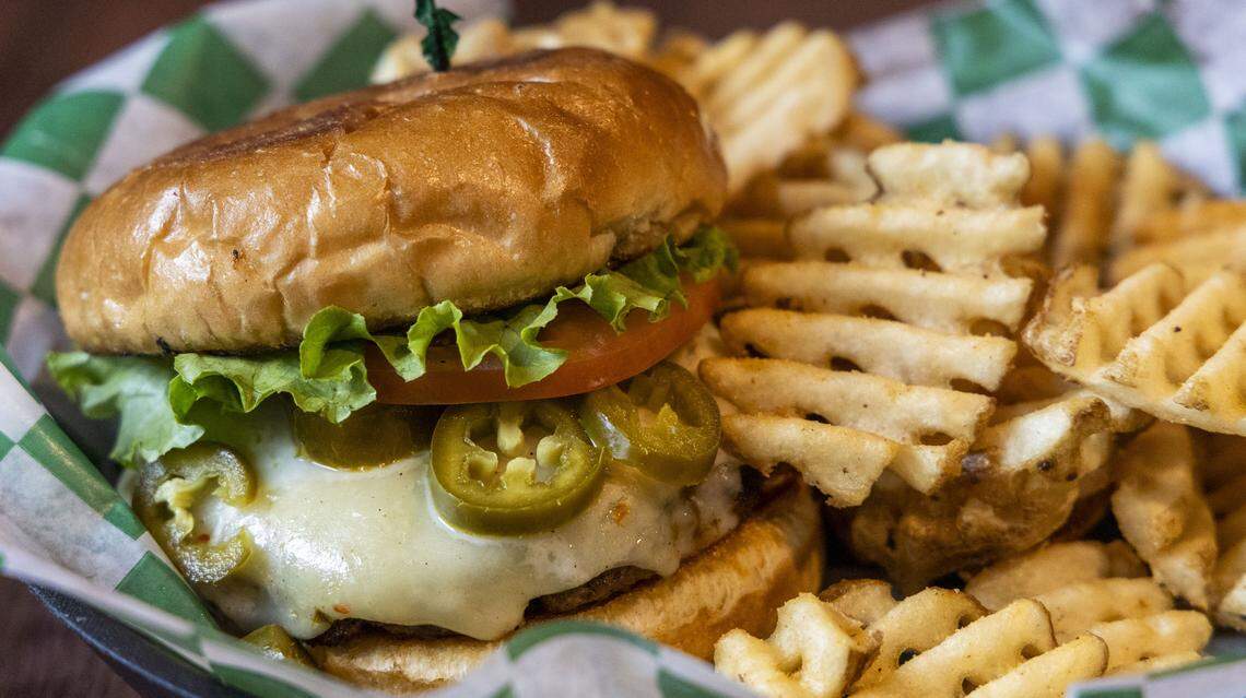 The Cajun O’Round burger with waffle fries. The spicy, blackened burger ($14.50) is topped with melted pepper jack cheese. Jalapeños can be added for an extra 50 cents. Waffle fires are the most popular substituted side at the Irish-themed restaurant.