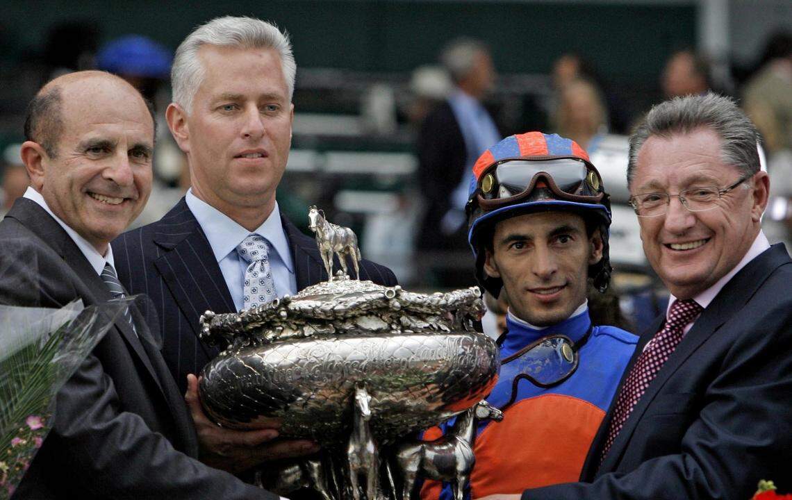 From left, Rags to Riches' co-owner Michael B. Tabor, trainer Todd Pletcher, jockey John R. Velazquez, and co-owner Derrick Smith won the 2007 Belmont Stakes at Belmont Park in Elmont, N.Y.  Rags to Riches was the first filly to win the race since Tanya won in 1905. This year, Tabor and Smith along with Susan Magnier have ownership stakes in two Kentucky Derby contenders, Mendelssohn and Solomini.