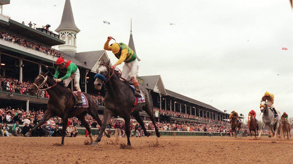 Silver Charm and jockey Gary Stevens, on the inside, nose out Captain Bodget and Alex Solis to win the 123rd running of the KY Derby.