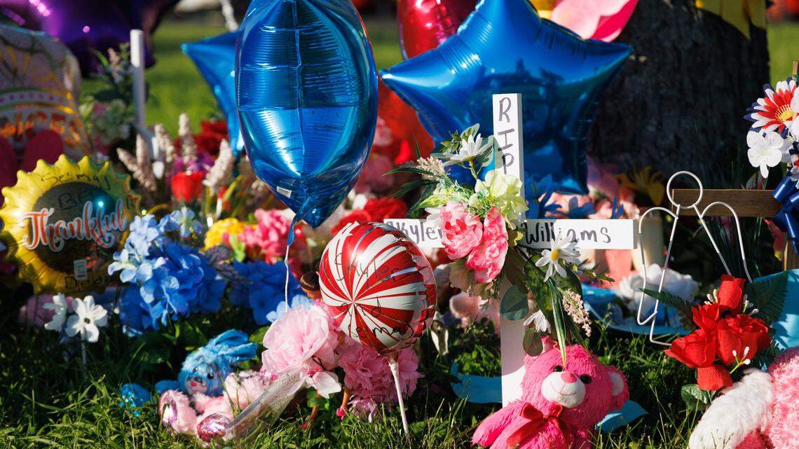 Members of the community and FaithPointe Church created a memorial during a vigil on Monday, May 9, 2022, at Parkway Plaza Apartments in Lexington, Kentucky, for Skyler Williams, 5, and Deon Williams, 13, who were killed last week. Their mother has been accused of killing the two children.