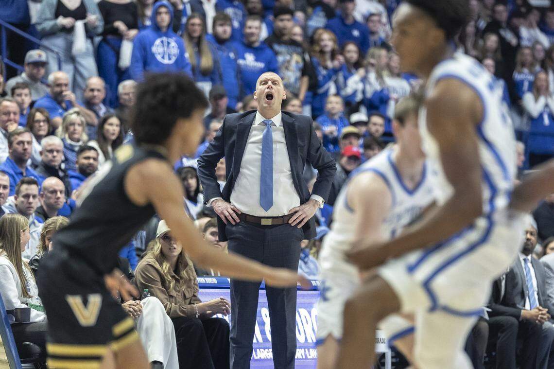 Kentucky head coach Mark Pope talks to his players during Wednesday’s game against Vanderbilt at Rupp Arena.