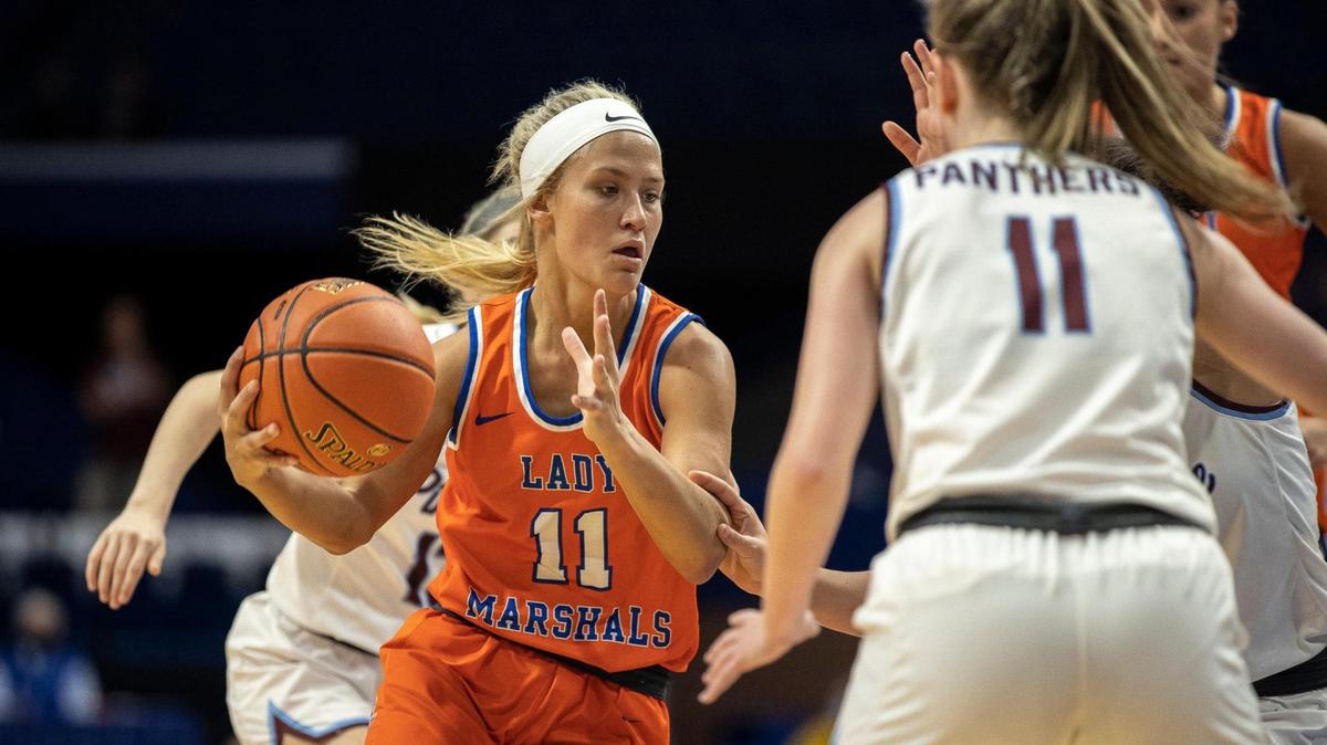 Marshall County’s Cayson Conner (11) drives to the basket as Pikeville’s Trinity Rowe (11) plays defense during a game at the KHSAA Girls’ Sweet 16 at Rupp Arena in Lexington, Ky., on Thursday, April 8, 2021.