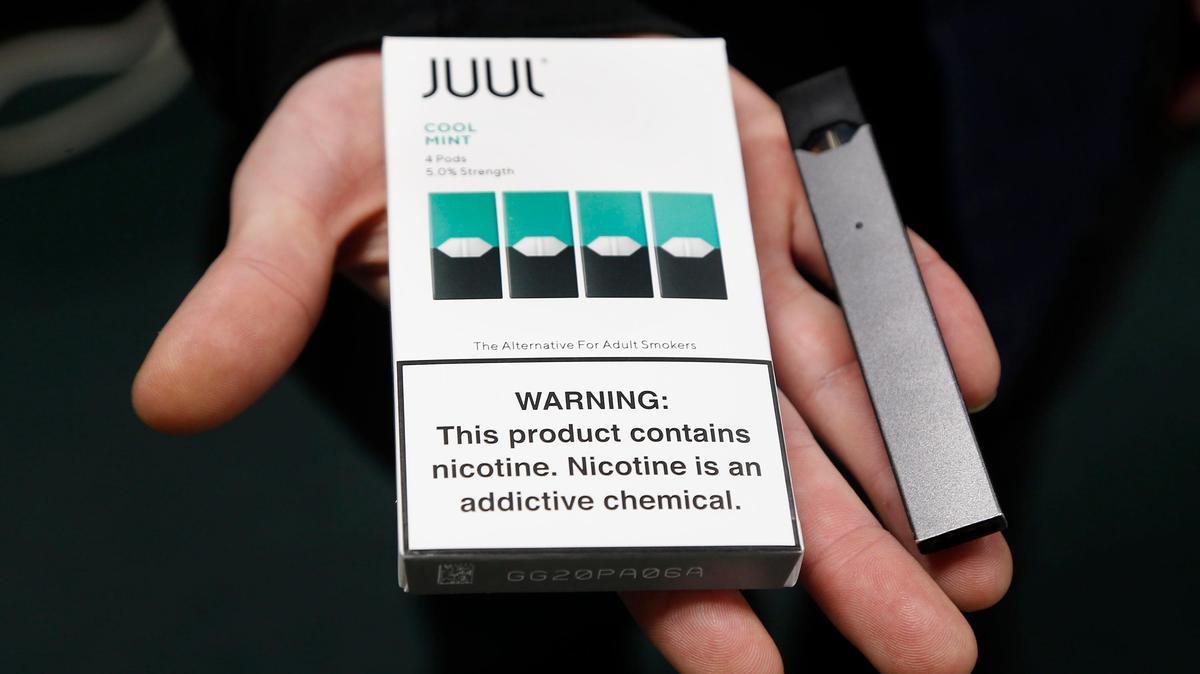 In 2018, Nick Gregory held JUUL pods and a JUUL device, right, at Botany Bay, 420 East New Circle Road in Lexington. Several Lexington high schools were concerned about an increase in use of E-Cig vaping by students.