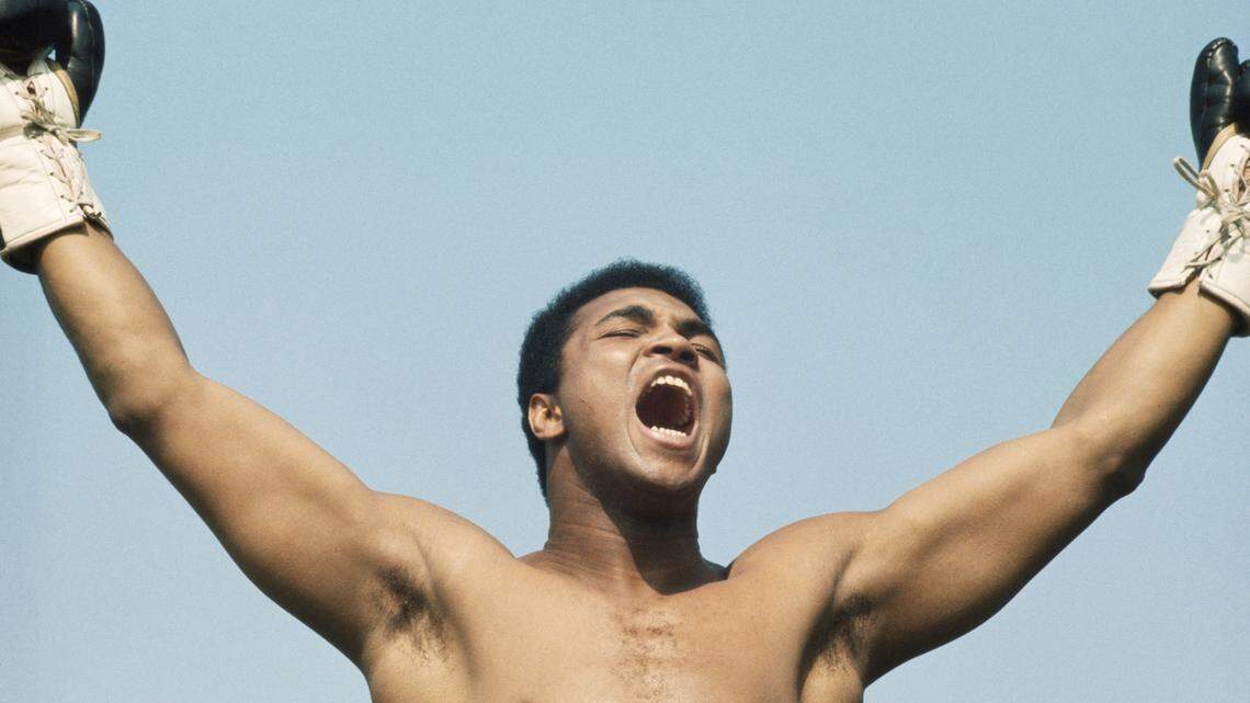 World Heavyweight boxing champion Muhammad Ali raises his arms and shouts during training on 10 July 1972 for his fight with Al ‘Blue’ Lewis held at Croke Park in Dublin, Republic of Ireland.Visions of Sport. (Photo by Don Morley/Allsport/Getty Images)