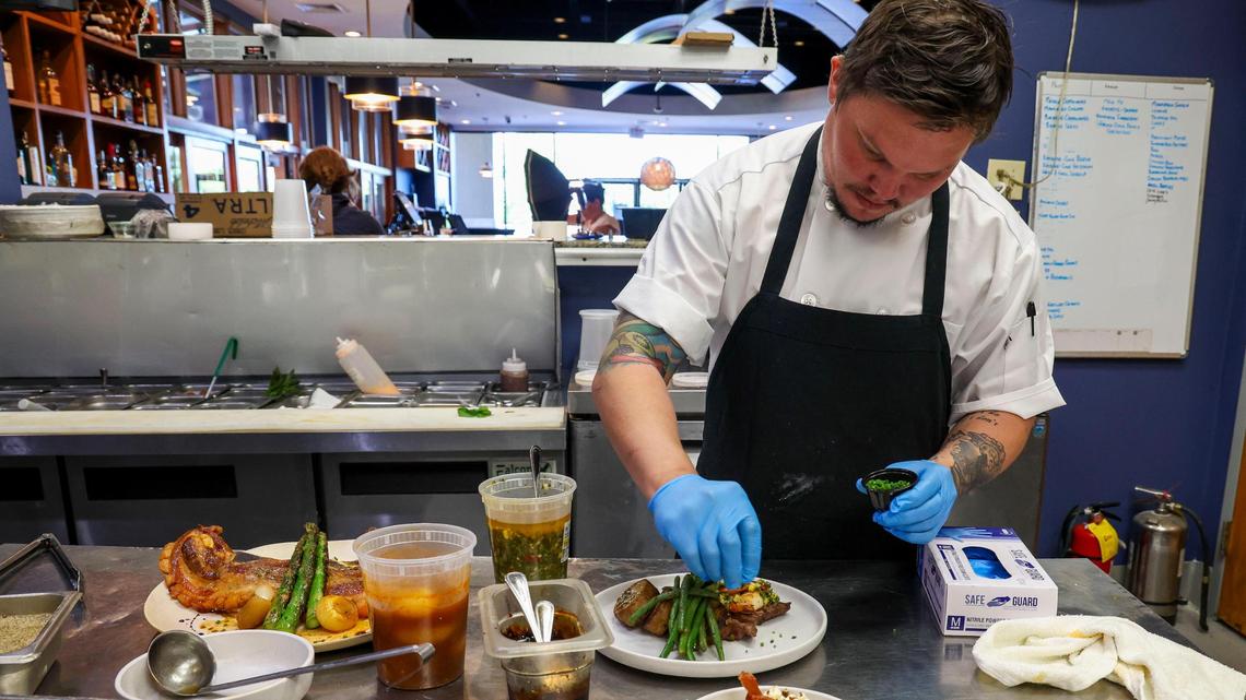 Azur Restaurant and Patio Head Chef Nathan Vazquez puts the finishing touches on a Surf & Turf dish Monday, May 20, 2025 in Lexington, Ky. Along with some of Azur’s classic dishes, Vazquez plans to introduces touches of his native of Puerto Rico to the restaurant’s menu.