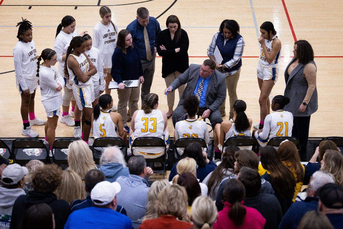 Franklin County head coach Joey Thacker talks to his team during a timeout in the 11th Region finals against Frederick Douglass at Paul Laurence Dunbar.