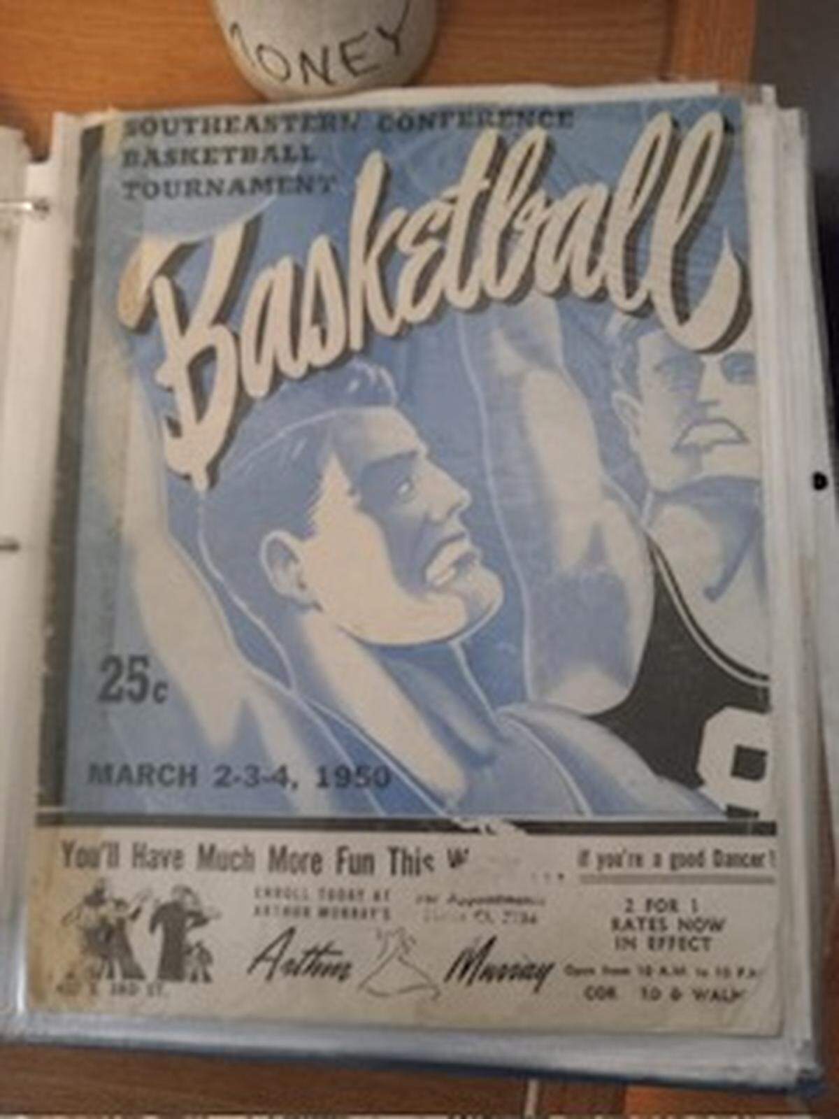 One of the items in William Watson’s Kentucky Wildcats men’s basketball memorabilia collection is a game program from the 1950 SEC Tournament.