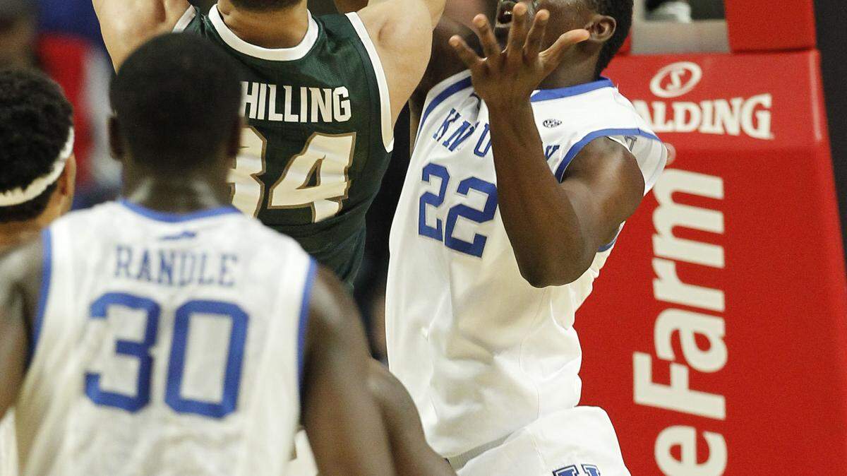 Kentucky forward Alex Poythress blocked a shot by Michigan State forward Gavin Schilling.