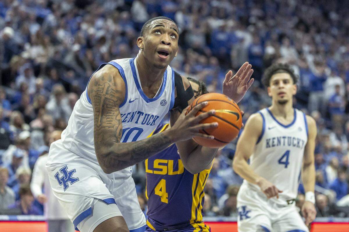 Kentucky forward Brandon Garrison (10) looks to shoot the ball as LSU guard Dji Bailey (4) defends during Tuesday’s game at Rupp Arena.