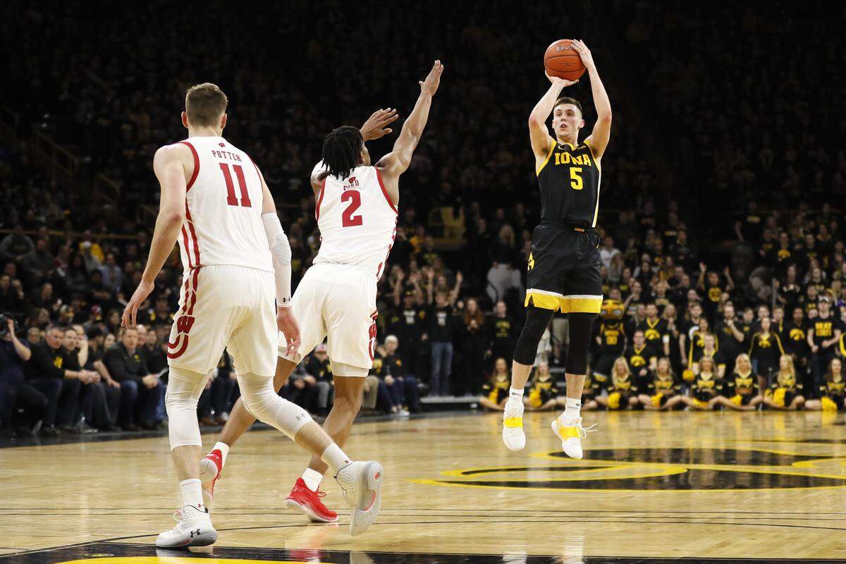 Iowa freshman guard CJ Fredrick, right, shot 46.1 percent from three-point range this season.