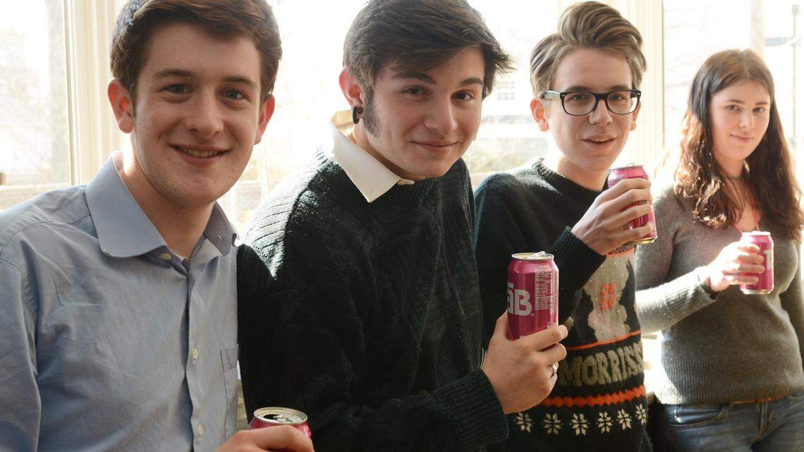 Friends, from left, Andrew Hardy, 15, Clay Whiteheart, 16, Max Morris, 16, and Abby Ryan, 17, of Lexington showed off their TaB cans. Morris turned his friends on to the drink after watching Back to the Future. He says he drinks two to three cans a day.  