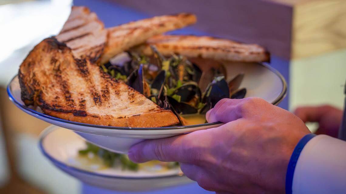 Buttered white wine mussels appetizer served with lemon, herbs and grilled sourdough bread ($28) from The V, the public restaurant at The Vine, a new downtown Lexington development.