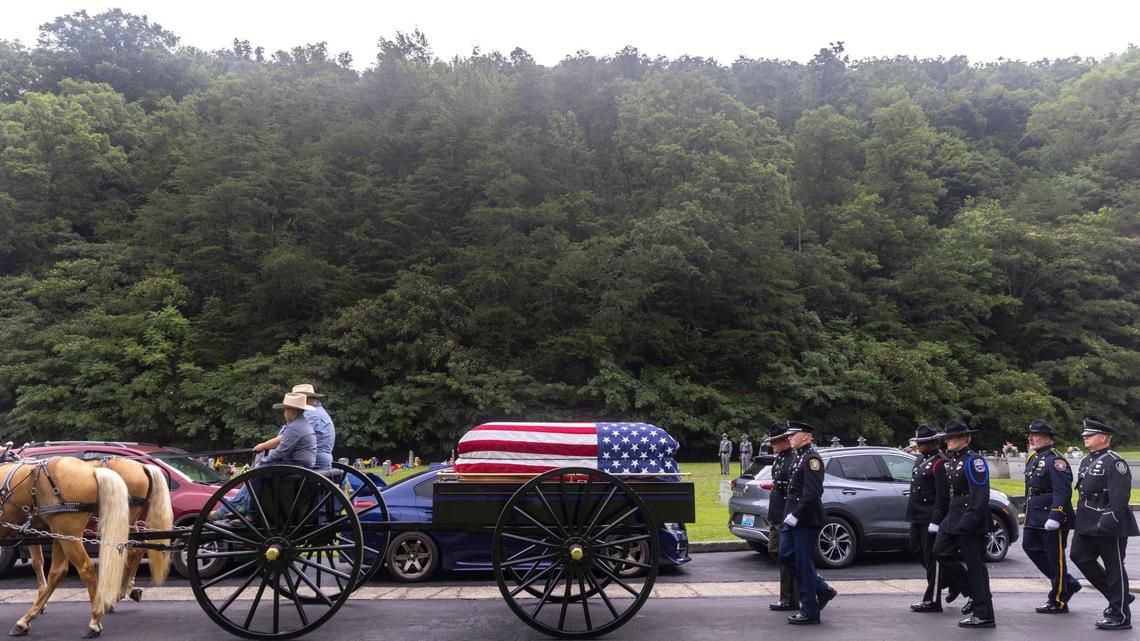 Prestonsburg Police Captain Ralph Frasure is laid to rest at the Gethsemane Gardens in Presontsburg, Ky., on Wednesday, July 6, 2022. Frasure was killed when a man with a rifle opened fire on police attempting to serve a warrant Thursday.