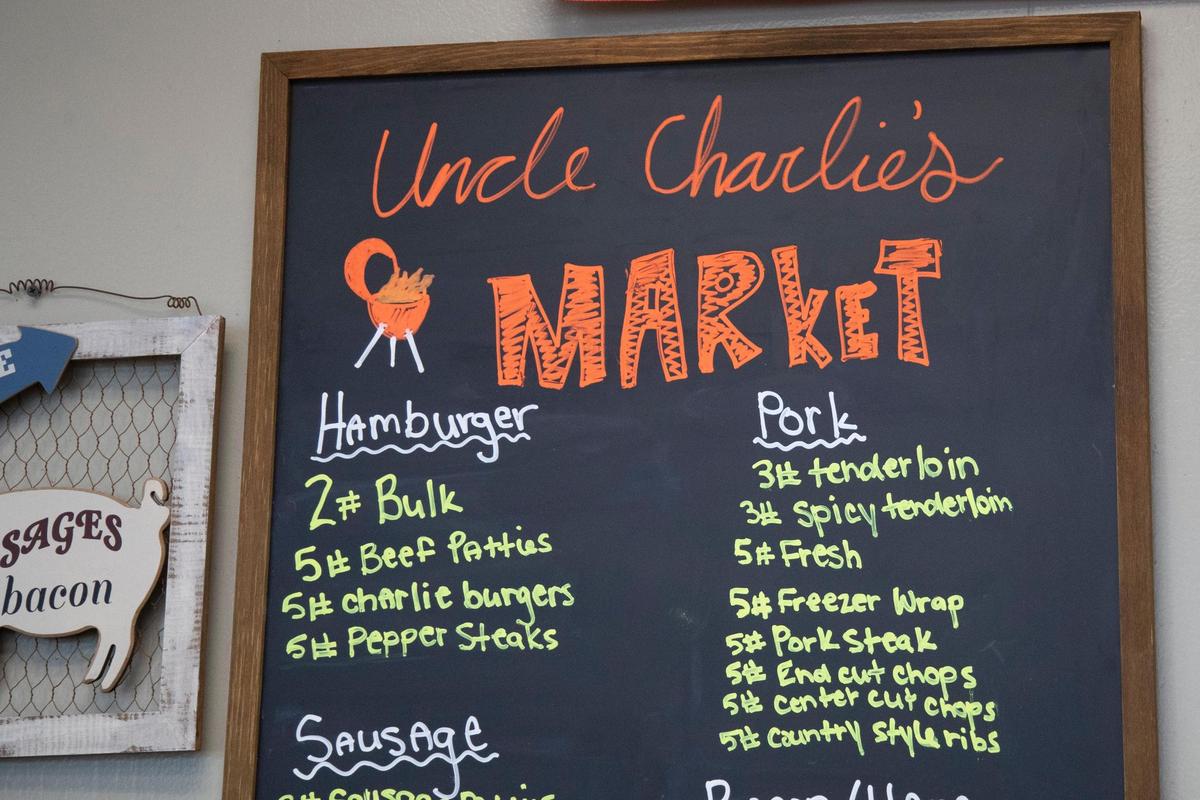 A sign of fresh and frozen meat offerings at Uncle Charlie’s Meats market location in Richmond, Ky., Friday, May 20, 2022.