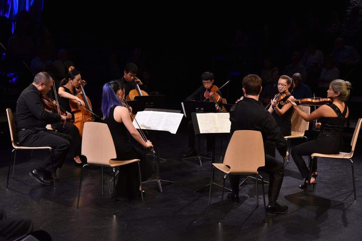 An ensemble of musicians from the Chamber Music Festival of Lexington and the Central Kentucky Youth Orchestras -- Burchard Tang, Priscilla Lee, Skye Park (back to camera), Nathan Tantasook, Jeffrey Shen, Nathan Cole (back to camera) Madeline Farrar and Akiko Tarumoto -- played Medelssohn’s Octet in 2018 at the Pam Miller Downtown Arts Center in Lexington, KY.