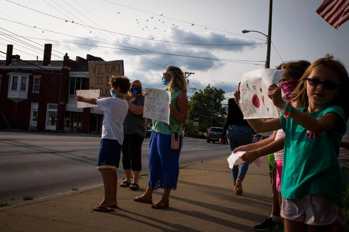 Students and parents participate in the Let Them Learn rally and protest outside the Fayette County Public Schools central office in Lexington, Ky, on Monday, September 14, 2020.