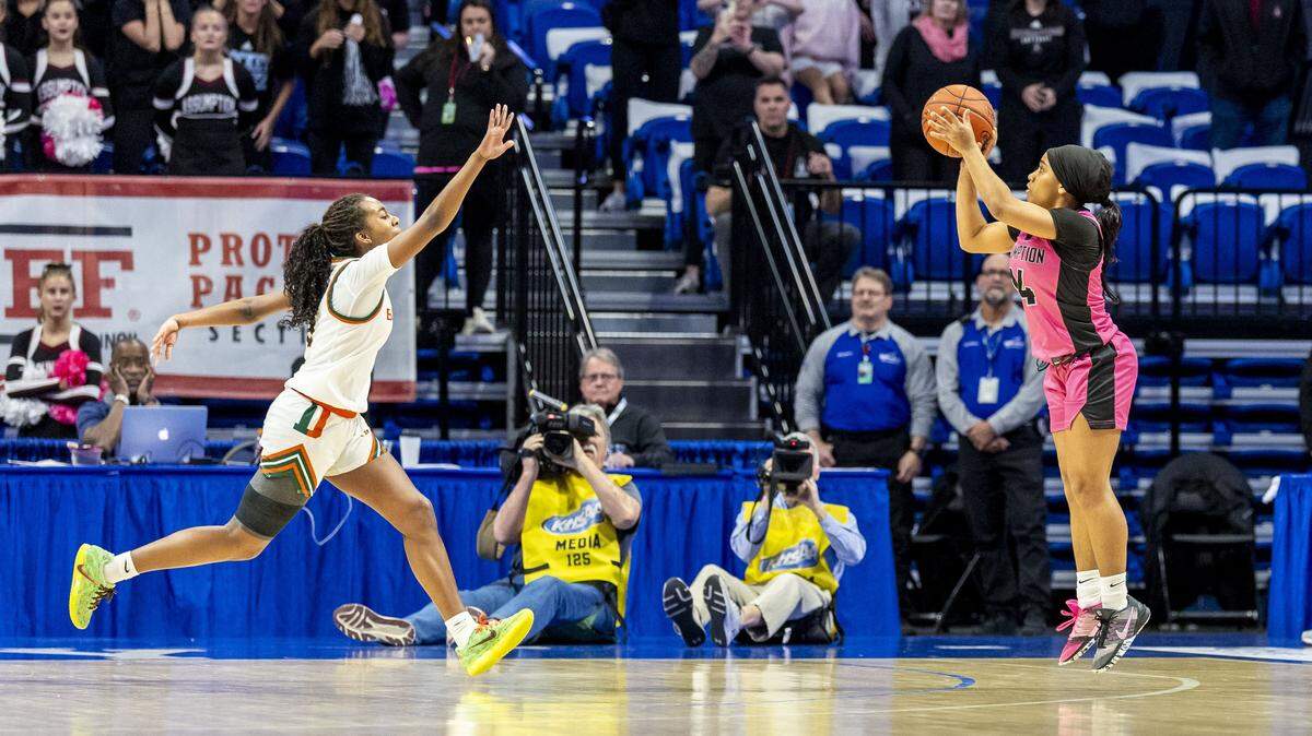 Assumption's Serae Bundrent-Palmer (24) puts up what would be the game-winning three-pointer over Frederick Douglass' Peighton Okorley (5) in the Rocket's 32-30 win in a second-round game in the 2026 Clark's Pump-N-Shop Girls' Basketball Sweet 16, Friday, March 13, 2026 at Rupp Arena in Lexington, Ky.