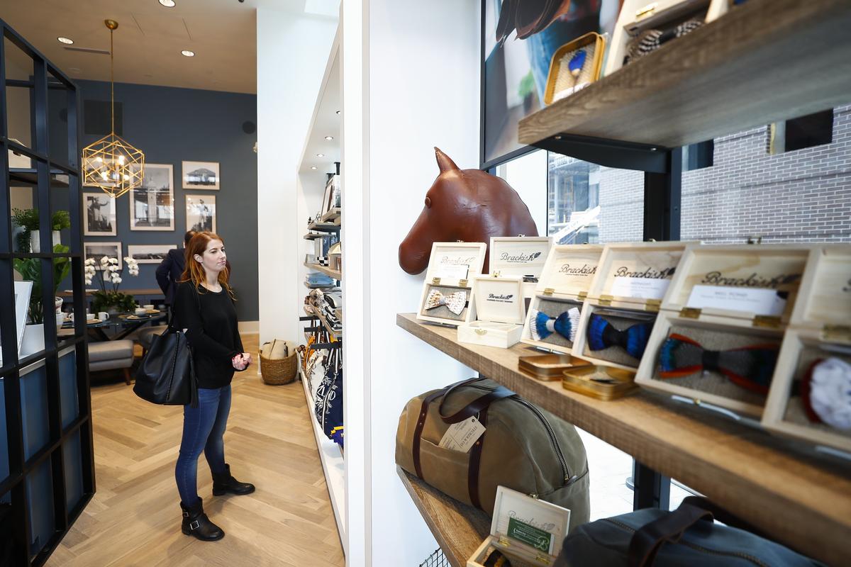 Natalie Schreyer, of Washington, D.C. browses products at Keeneland Mercantile at City Center in downtown Lexington. It opens officially on Wednesday.