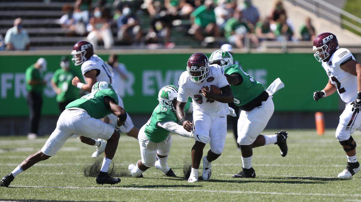 Eastern Kentucky running back Alonzo Booth (34) ran the ball against Marshall on Saturday afternoon in Huntington, W.Va. He gained 33 yards on 15 carries.