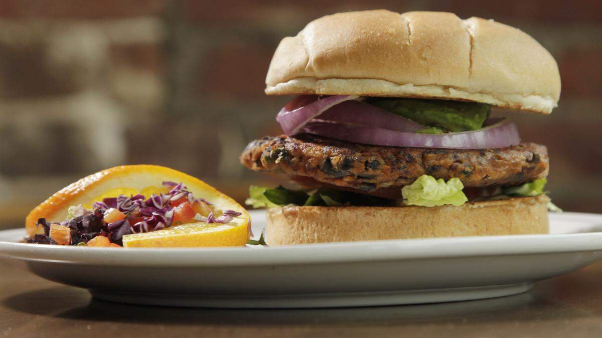 Alfalfa's in Lexington serves a black bean quinoa burger. The recipe, which also includes peppers, onions, paprika and cumin, is on Page C6.  
