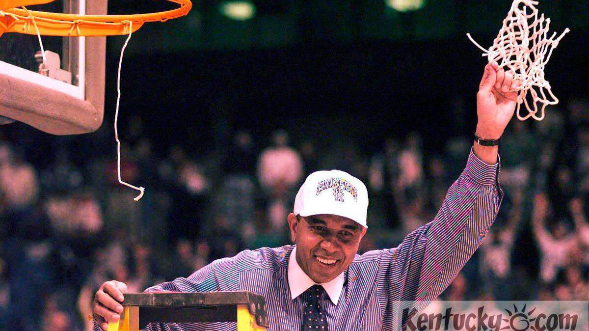 UK coach Tubby Smith holds the net after defeating Duke 86-84 in the  NCAA  South Regional Final in St. Petersburg, FL Sunday March 22, 1998. Photo by Frank Anderson | Staff