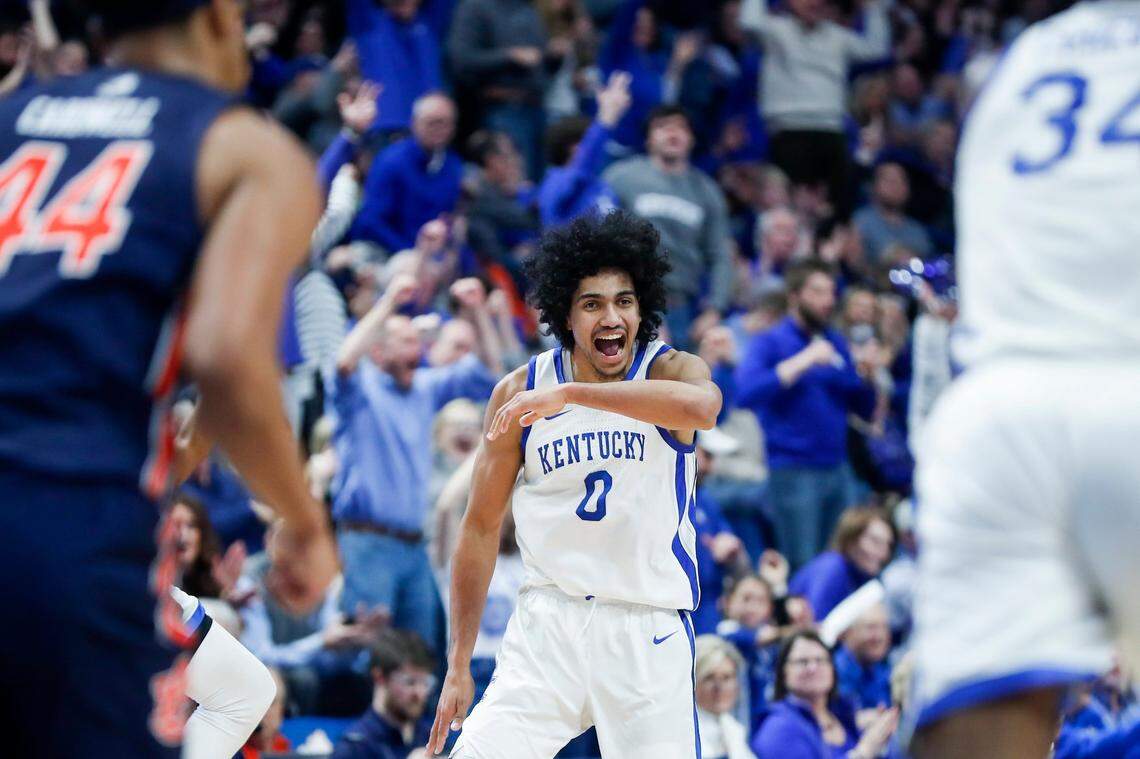 Kentucky forward Jacob Toppin (0) celebrates Antonio Reeves hitting a three-pointer against Auburn during Saturday’s game at Rupp Arena. The Wildcats connected on 8 of 13 attempts from long range.