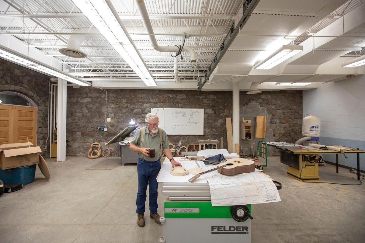 Doug Naselroad, Troublesome Creek Stringed Instrument Company director, discusses a mandolin that is under construction in Hindman, Ky., Wednesday, Oct. 9, 2019.