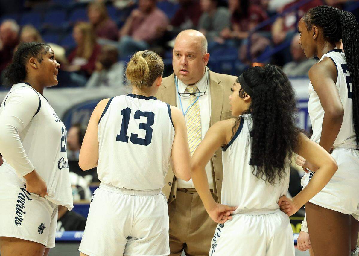 Danville Christian head coach Billy Inmon instructs his team during its quarterfinal game against Henderson County on Friday night.