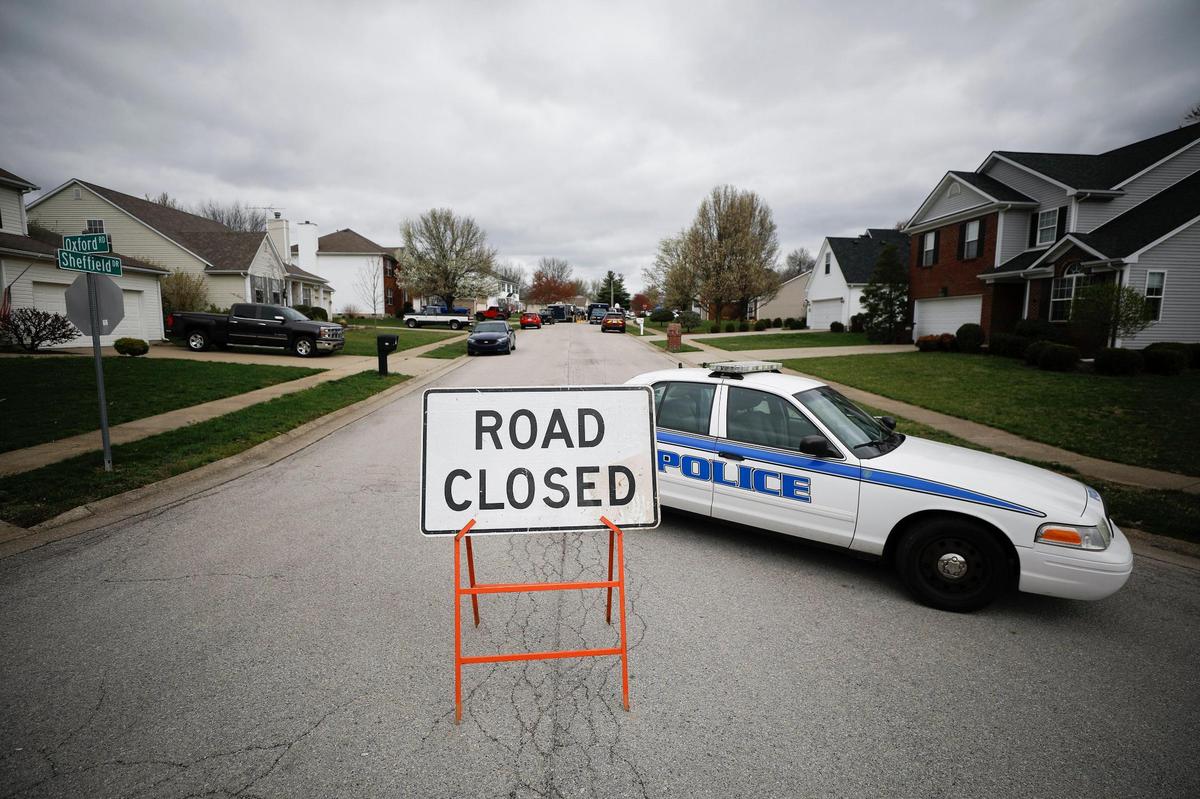 A police car blocked Sheffield Drive as authorities investigated the home of Bryan Carroll in Versailles Friday.