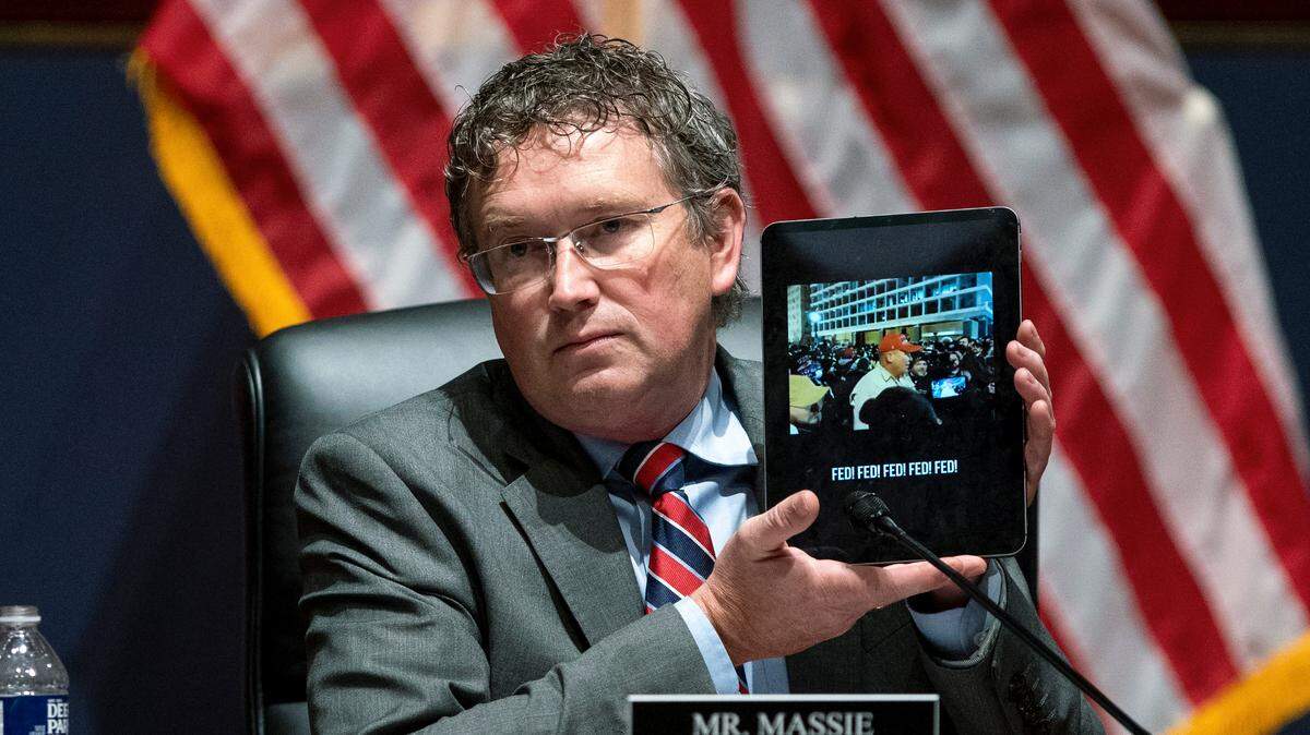 Rep. Thomas Massie, R-Ky., holds up an iPad with a video of the Jan. 6, 2021, playing as he questions Attorney General Merrick Garland during a House Judiciary Committee oversight hearing of the Department of Justice on Thursday, Oct. 21, 2021, on Capitol Hill in Washington. (Greg Nash/Pool via AP)