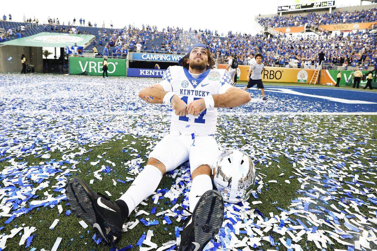 Kentucky quarterback Walker Wood (17) celebrated with confetti after UK beat Penn State 27-24 in last season’s VRBO Citrus Bowl. The former Lafayette High School star has battled injuries and their aftereffects since arriving at UK.