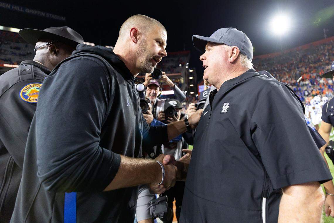 Florida head coach Billy Napier and Kentucky head coach Mark Stoops shake hands after Florida’s 48-20 victory at Ben Hill Griffin Stadium in Gainesville.
