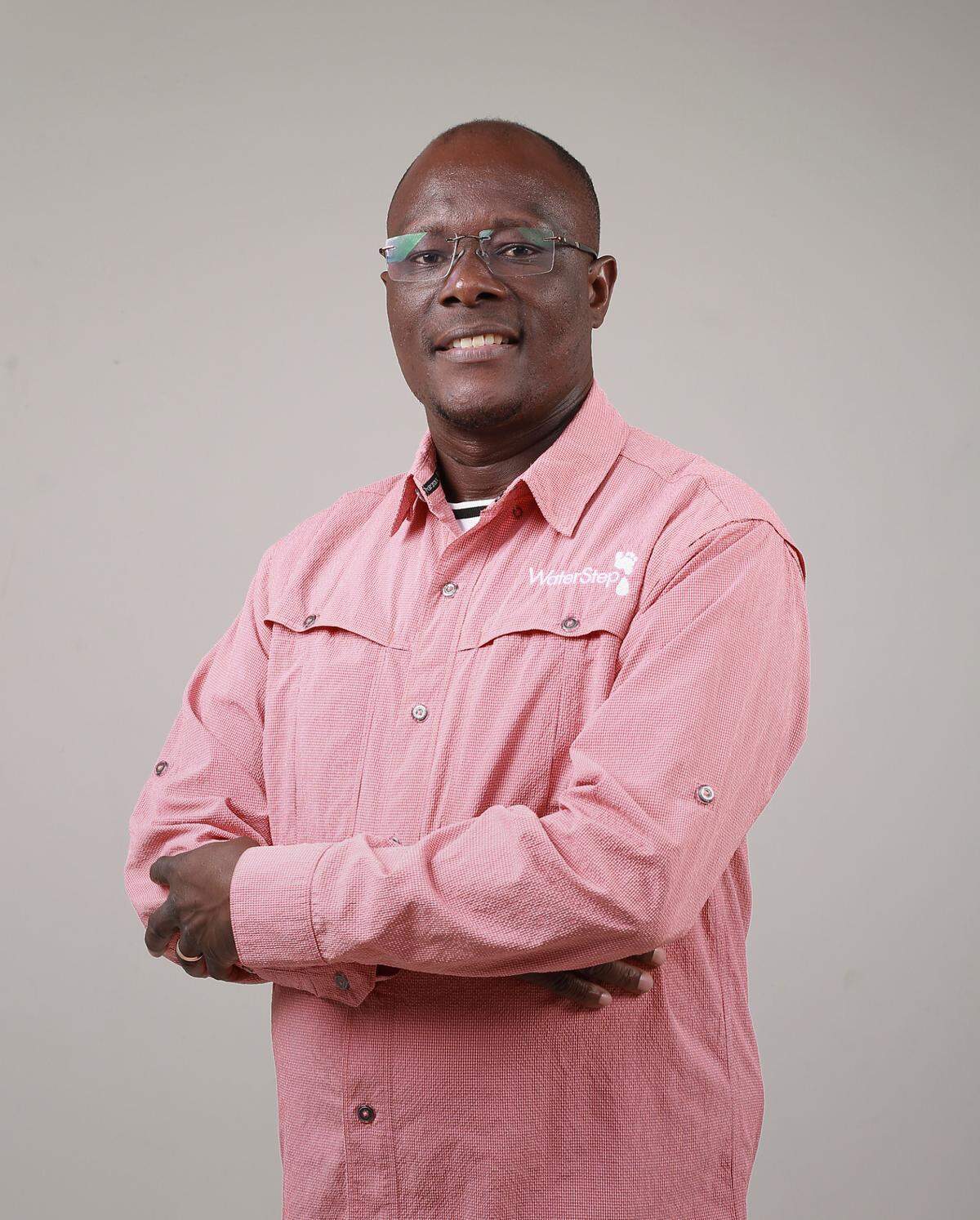Jareld Malamba, a field consultant for WaterStep and founder and team leader of Africompassion, poses for a photo.
