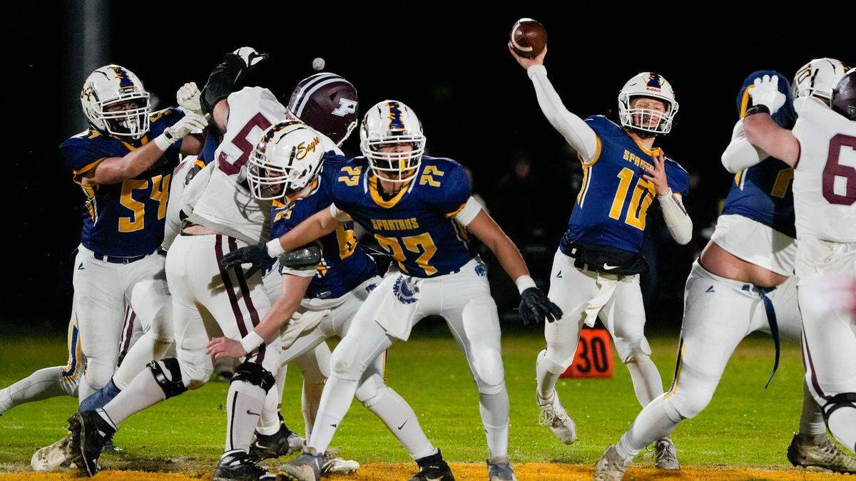 Sayre’s Luke Pennington (10) unleashes a pass during Friday night’s win in the Class A quarterfinals in Lexington.